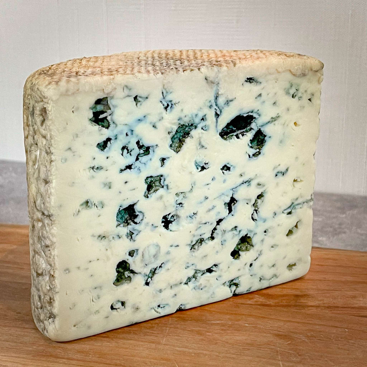 Strong tasting cheese: Image is of a quarter wheel of Fourme d'ambert blue cheese