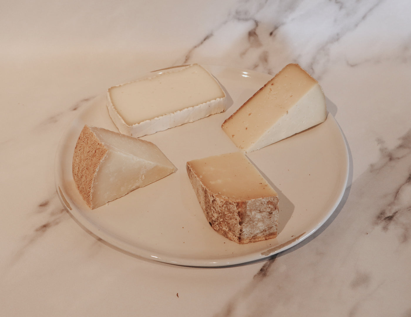 Explore Cave-Aged Cheeses: July Cheese Club Selections