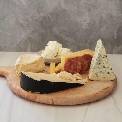 cheese board with 5 cheeses on it from one month of Antonelli's cheese club