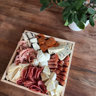 Cheese & Charcuterie Board Small on a picnic Table with greenery