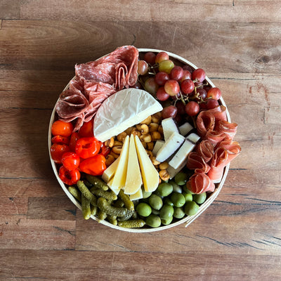 image of a charcuterie board for two on a picnic table top view