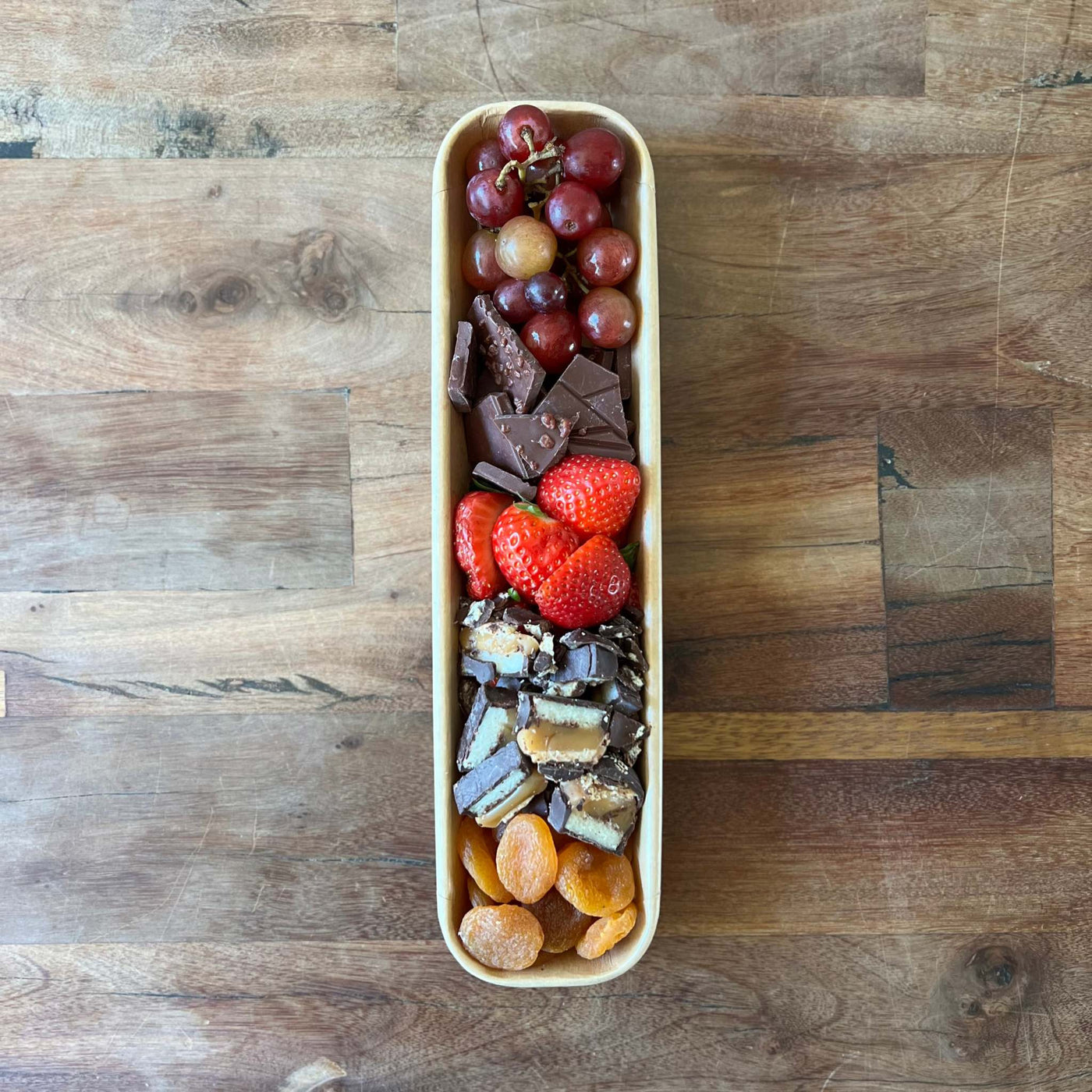 dessert tray with chocolate and fruit