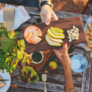 two people sharing cheese