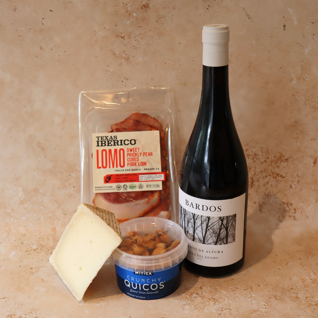 Taste of spain package includes manchego, charcuterie, quicos and wine