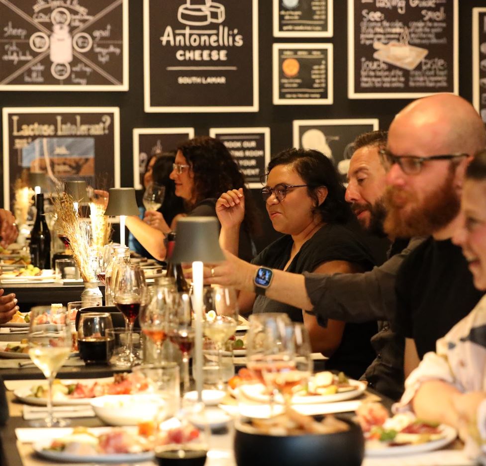 image of customers enjoying a cheese tasting at south lamar