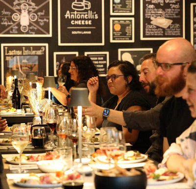 images of customers having fun at a cheese tasting