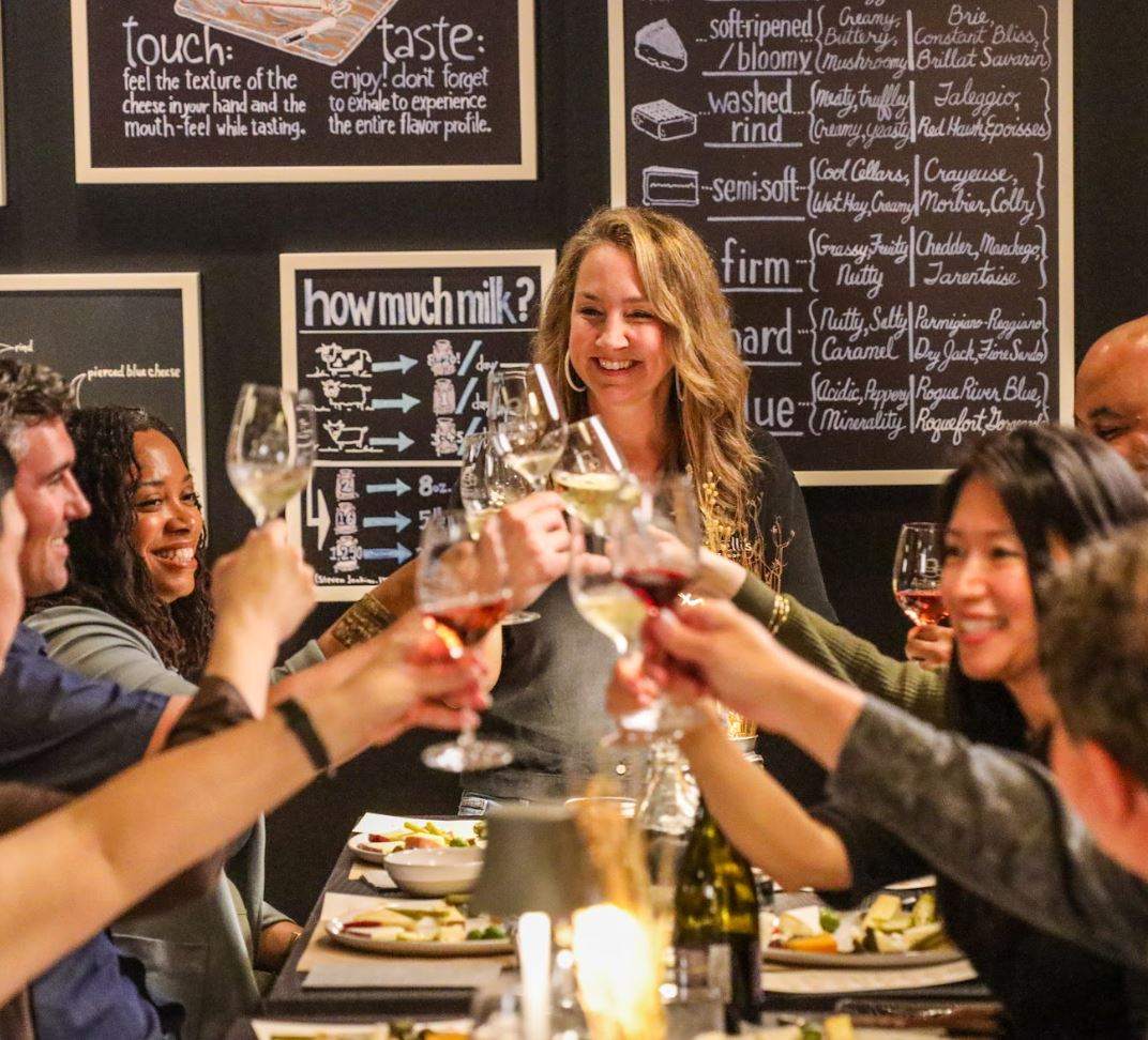 image of customers clinking glasses at south lamar tasting room