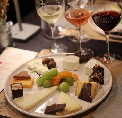 image of chocolate and cheese plate with wine