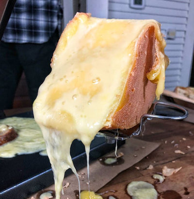 upclose image of melting raclette cheese